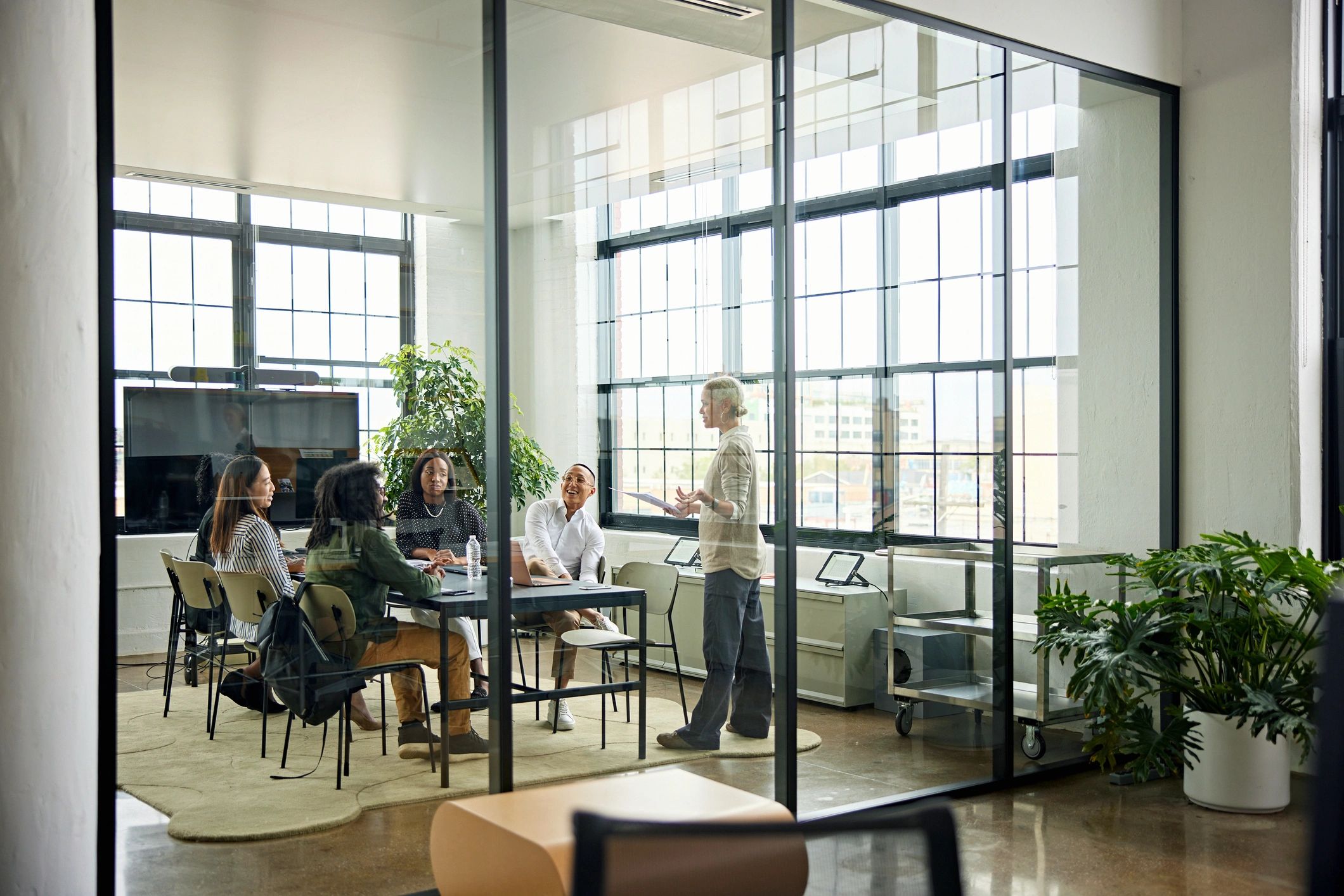 DIH MEITS team collaborating in a modern conference room