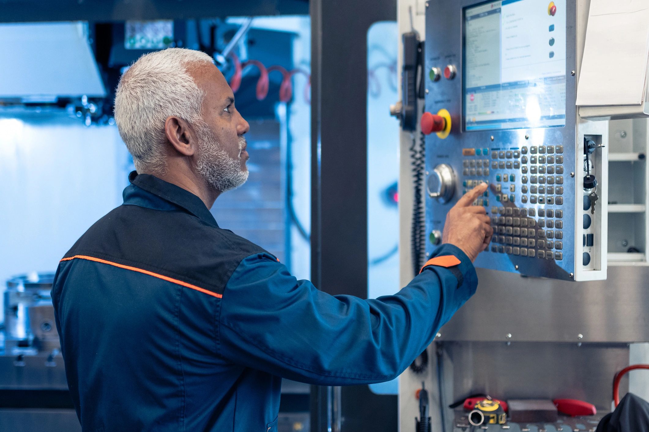 Mechanical engineer monitoring production equipment