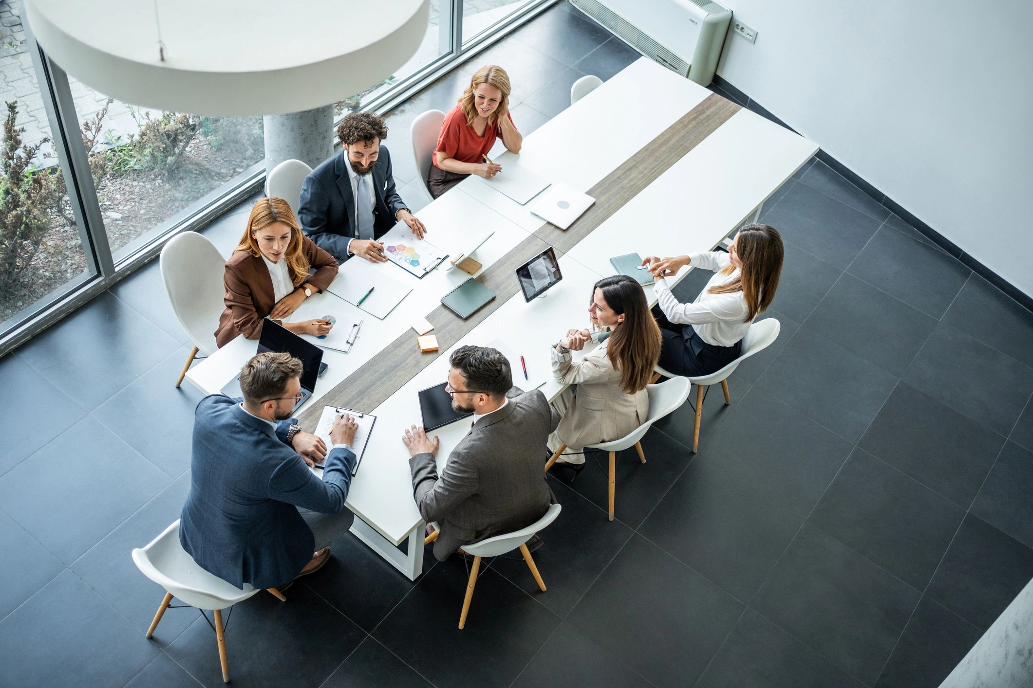Public-sector leaders collaborating in a modern strategy meeting
