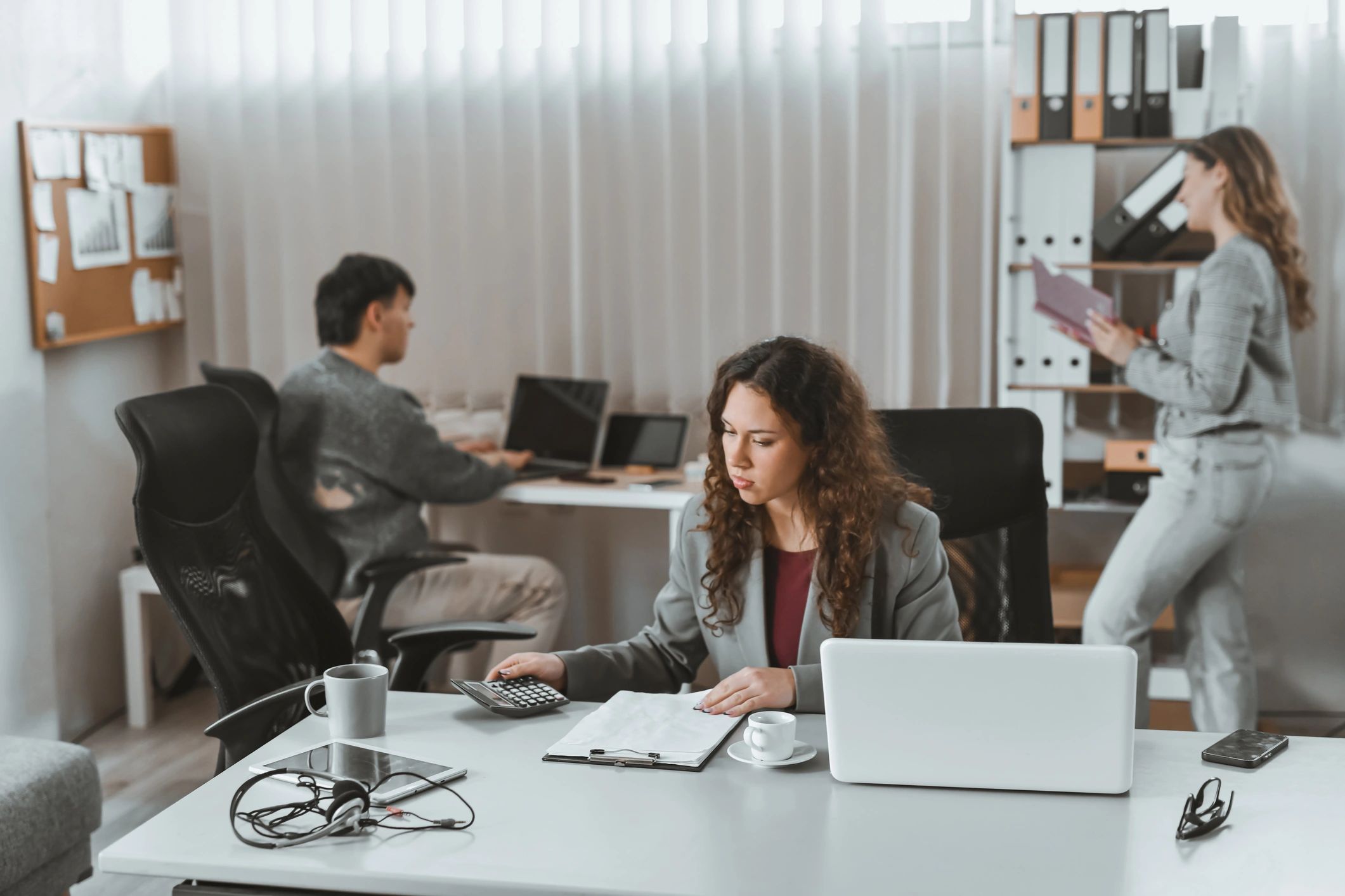Professional using a laptop in a modern office workflow