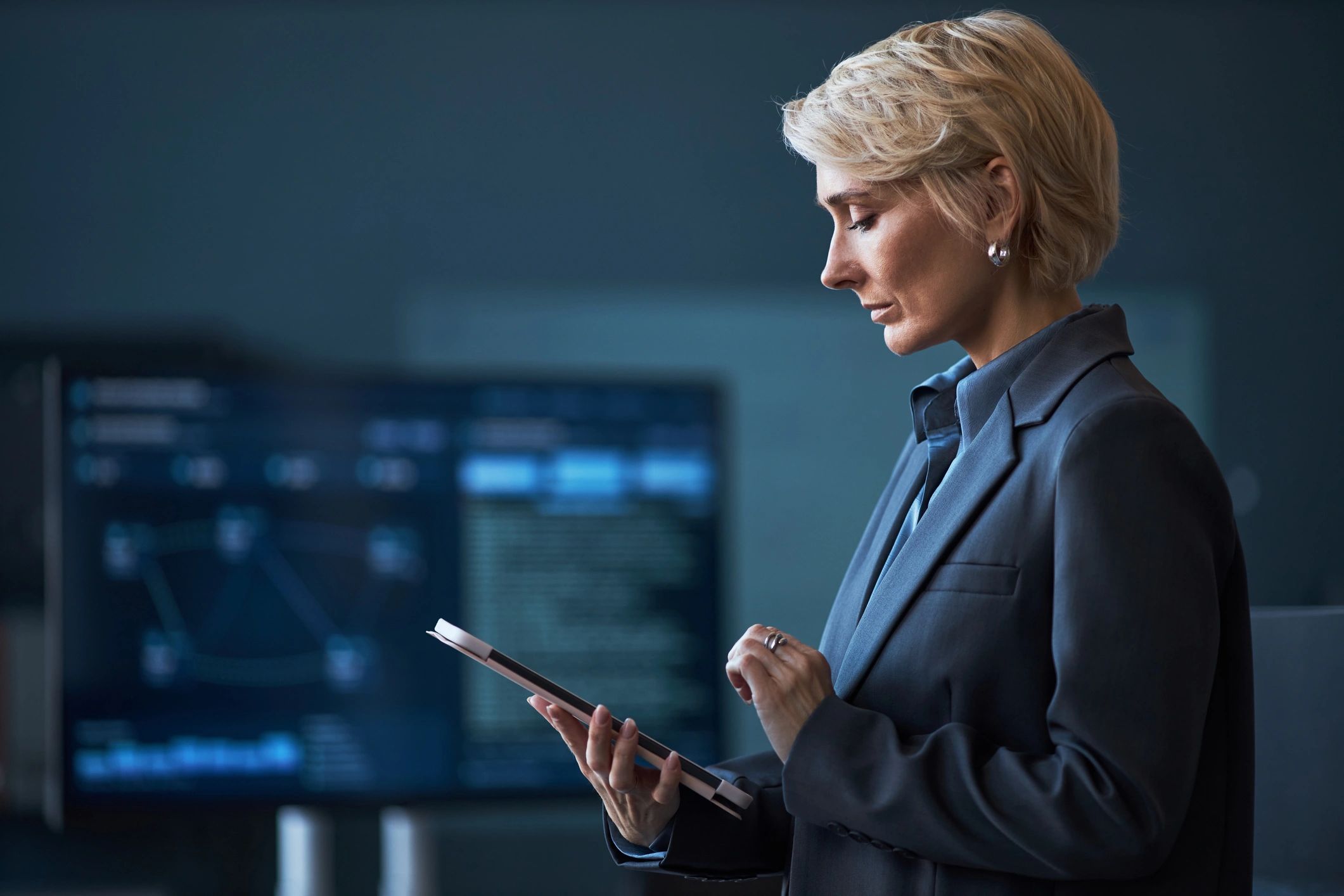 Business leader reviewing data on a tablet