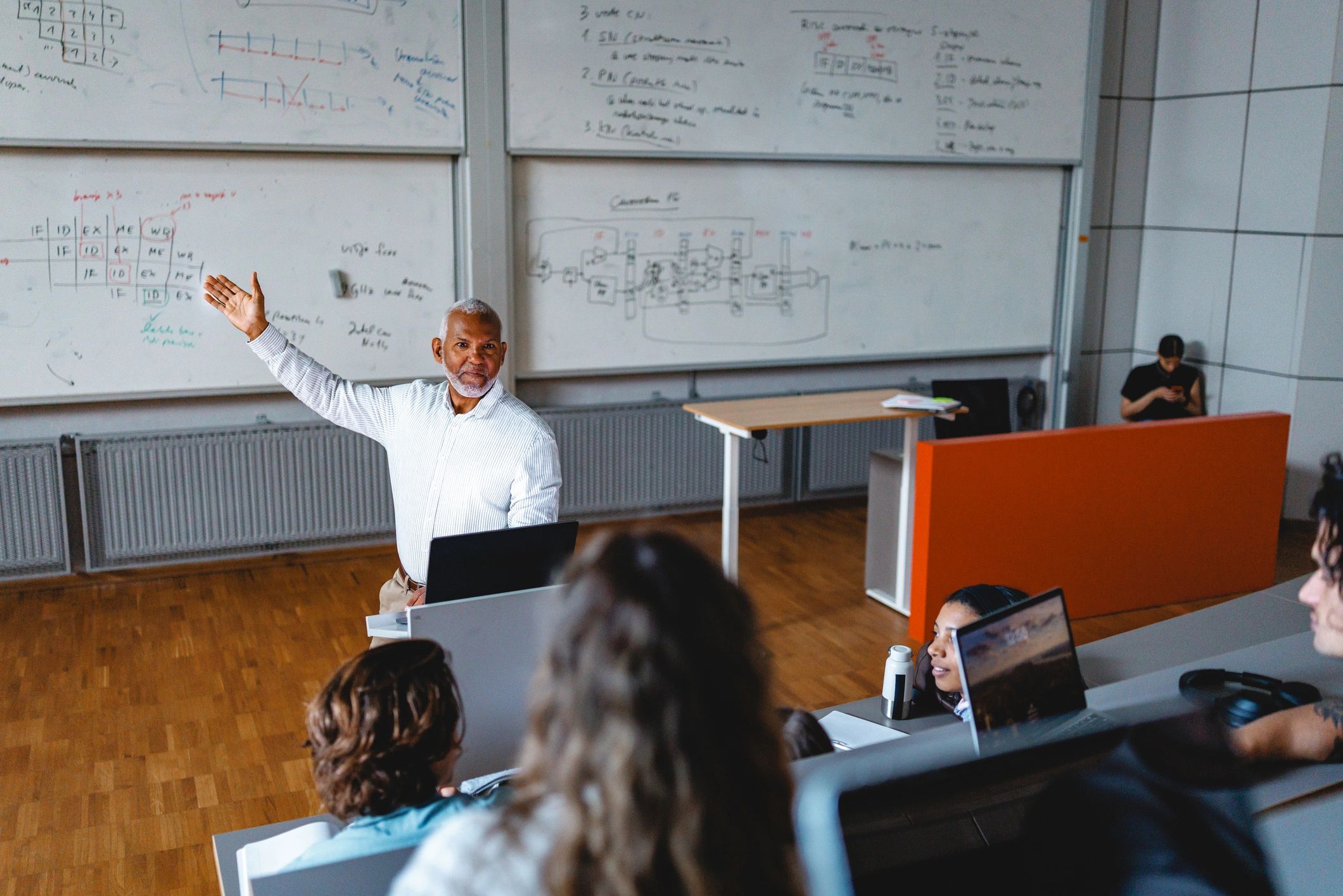 University lecturer teaching students in a lecture hall